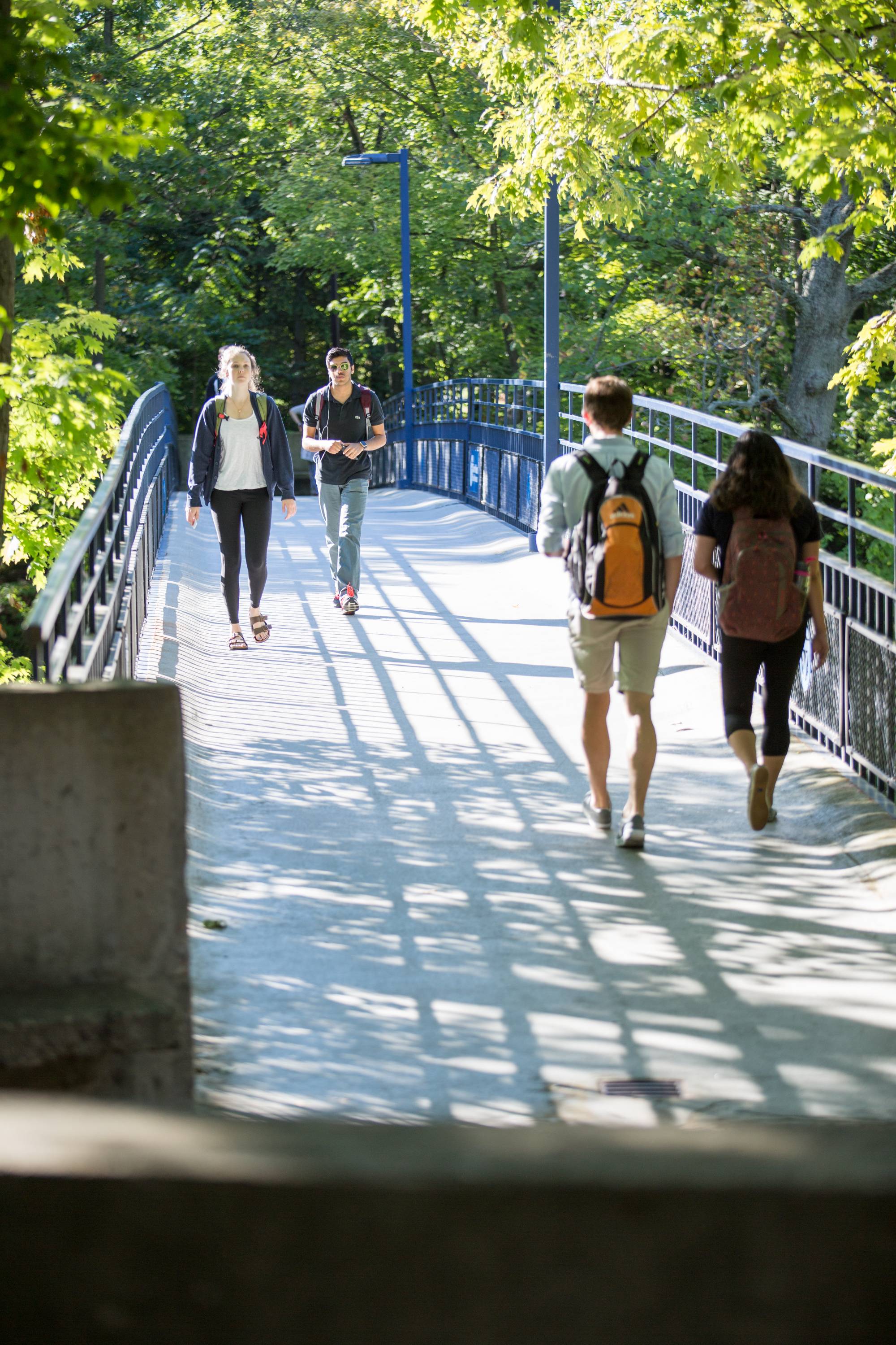 People walking on the Little Mac Bridge